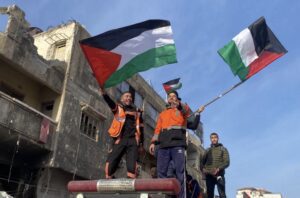 First aid and civil defense workers demonstrate their joy after the announcement of ceasefire, January 19, 2025 in Gaza City, Gaza