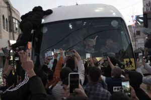 Palestinian prisoners are welcomed by their relatives within in the town of Beitunya in the West Bank city of Ramallah on January 30, 2025.