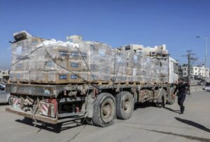 Trucks carrying aid passing through the Kerem Abu Salim Border Gate into Gaza Strip, January 21, 2025 