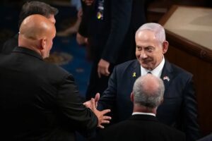 Israeli Prime Minister Benjamin Netanyahu shakes the hand of Sen. John Fetterman, who has been one of Israel’s most vocal Democratic supporters in Congress, at the US Capitol on July 24, 2024.