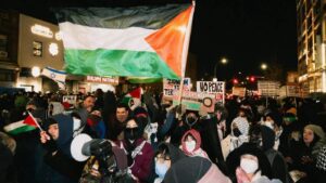 People in New York City's borough of Brooklyn protest against the 'selling' of land in the occupied West Bank by an Israeli real estate company, on 18 February