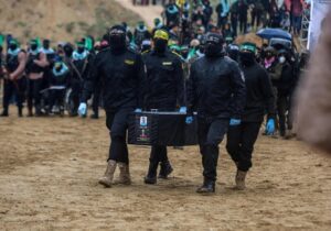 Members of Hamas' armed wing, the Al-Qassam Brigades, carry a coffin believed to contain the remains of one of the Bibas children, who were taken captive along with their parents during the group's Oct. 7, 2023 resistance operation, Khan Younis, southern Gaza, Feb. 20, 2025.