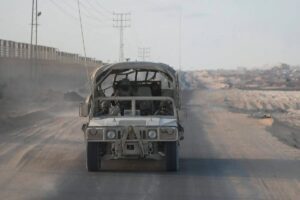 Israeli soldiers patrol along the Philadelphi corridor in Rafah in the Gaza Strip on September 13, 2024