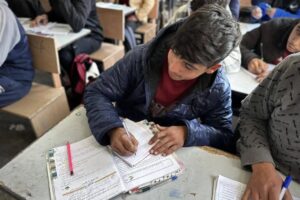 Students studying at Muscat High School which was damaged in Israeli attacks, as education started again after it was suspended about a year and a half ago due to Israeli attacks in the Nuseirat Refugee Camp of the Deir al-Balah, Gaza on February 19, 2025. 