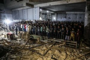 Palestinians perform the first Tarawih prayer of Ramadan on the ruins of Al-Lebbani Mosque, which was destroyed in Israeli attacks, in Khan Younis, Gaza, on February 28, 2025.