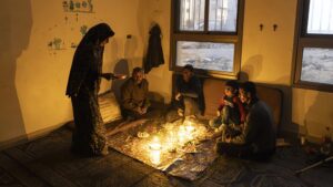 Palestinians spend their time under hard conditions during the holy month of Ramadan, finding shelter where they can after their house is destroyed during an Israeli attack.