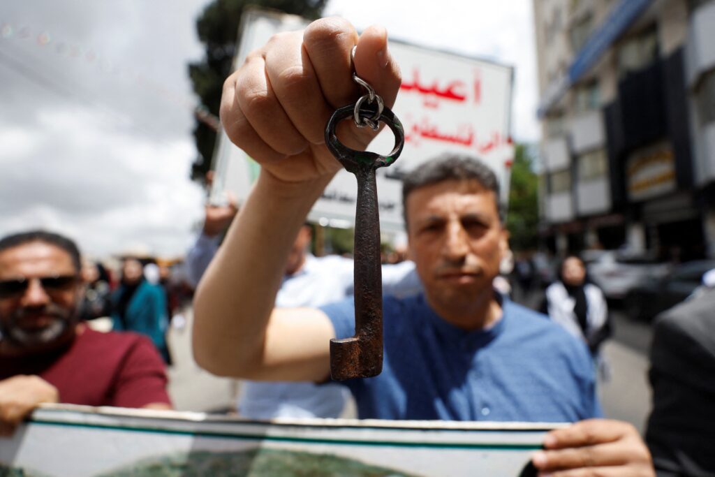 One man shows his key – a symbol of both dispossession and hope – as Palestinians march in Ramallah, in the occupied West Bank, to commemorate the Nakba—or ‘catastrophe’—the 1948 ethnic cleansing of Palestine during Israel’s founding. May 15, 2025