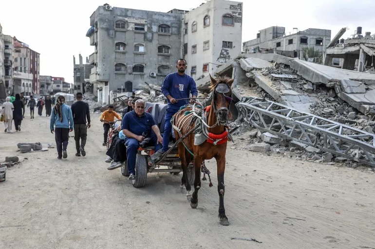 Palestinians, who face fuel shortages due to the Israeli attacks, use donkeys and horse-drawn carts for transport due to the closure of border gates and the ongoing blockade in Khan Younis, May 5, 2025