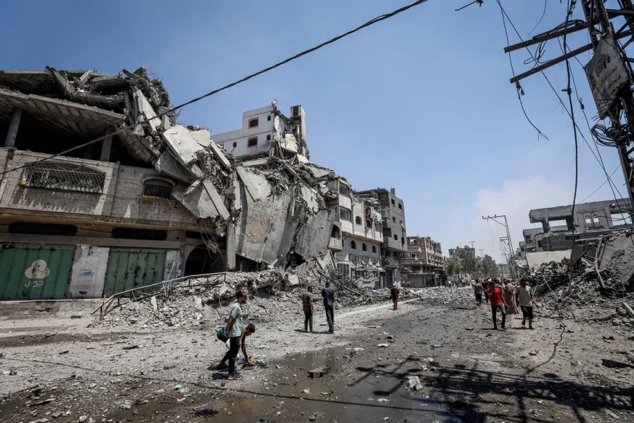 Smoke rises and Palestinians flee the site after Israeli army conduct attacks over al-Zeitoun neighborhood of Gaza City, Gaza on August 06, 2025.