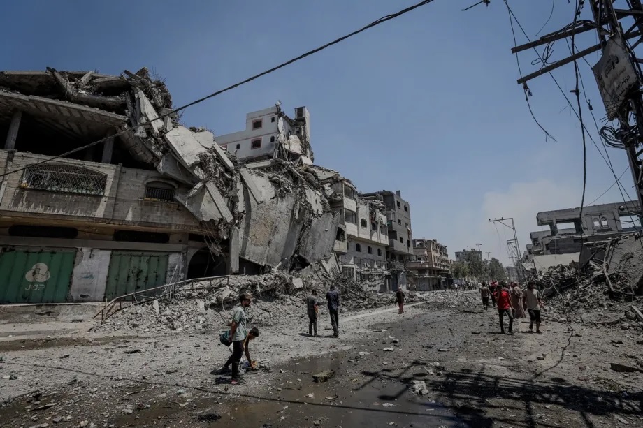 Smoke rises and Palestinians flee the site after Israeli army conduct attacks over al-Zeitoun neighborhood of Gaza City, Gaza on August 06, 2025.