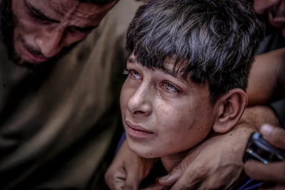 A child, relative of Palestinians who died in Israeli army attacks on the northern Gaza Strip, cries as the remains are taken for burial in Gaza City, Gaza on August 31, 2025.