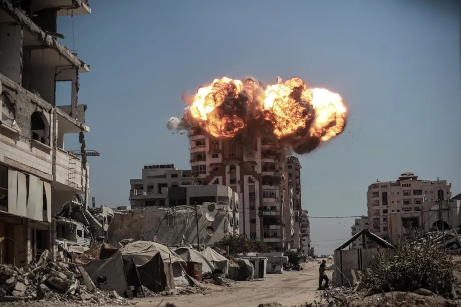 Smoke rises following Israeli airstrikes that hit and destroyed multiple buildings and high-rise towers in Gaza City, Gaza on September 14, 2025.