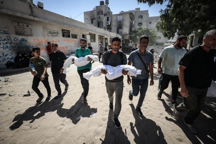 Relatives of the Abu Salmiya family, whose apartment in Al-Shati refugee camp was attacked by Israel, carry the dead bodies as bodies for burial in Gaza City, Gaza on September 20, 2025.