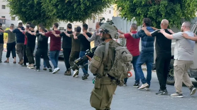 Israeli soldiers round up and arrest Palestinians in the occupied West Bank’s Tulkarem earlier this month