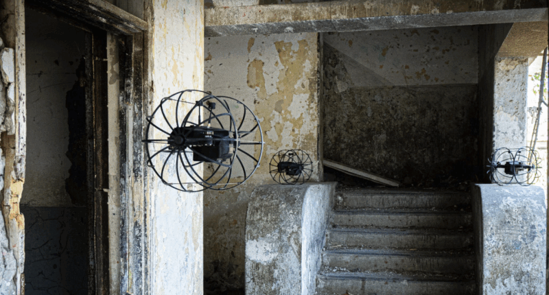 Three ROOSTER drones during an indoor operation.