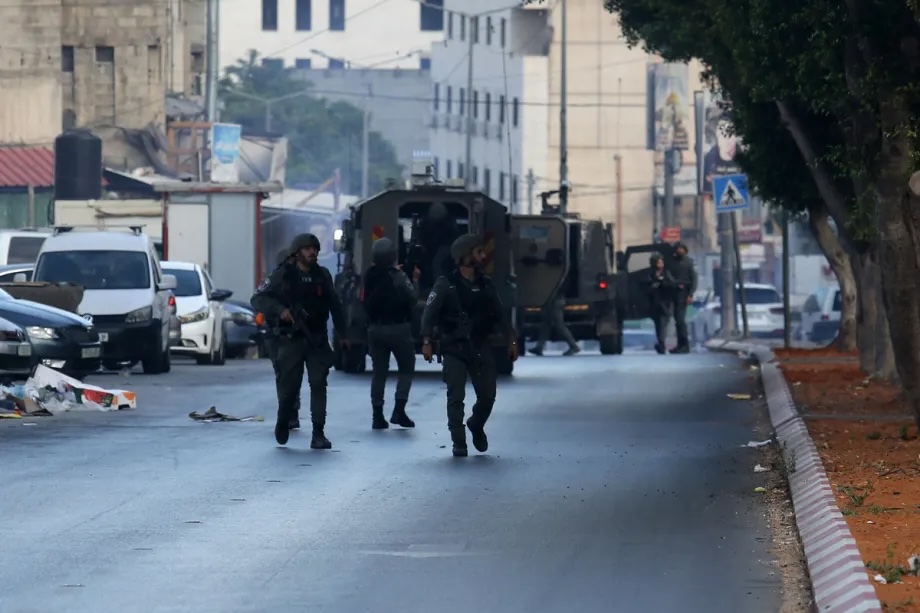 Israeli soldiers patrol on street during a raid on Salam Neighborhood in Nablus, West Bank on May 29, 2025.