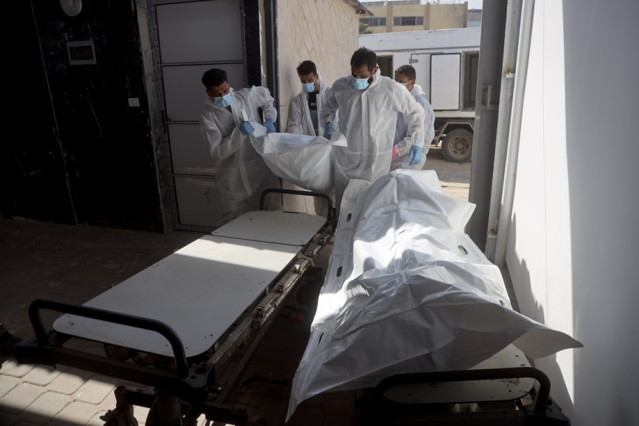 Red Cross teams deliver the bodies of 30 Palestinians, who were detained by Israeli forces during the war and handed over as part of the ceasefire deal, to Nasser Hospital in Khan Younis, Gaza, on October 30, 2025.