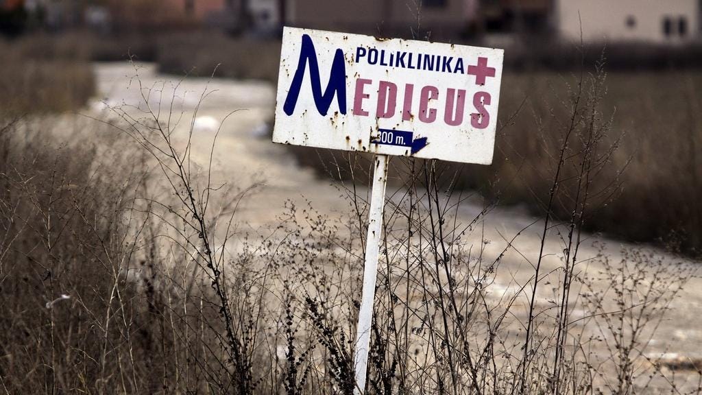 A sign welcoming visitors to Medicus, Pristina, Kosovo