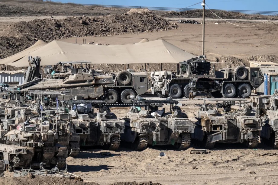 Israeli military vehicles are gathered along the border following the implementation of the ceasefire and Israeli withdrawal, on October 14, 2025.