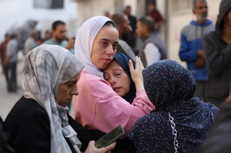 Loved ones grieve after the Israeli army killed three Palestinians and wounded others in southern Gaza on Thursday, Nov. 20, 2025