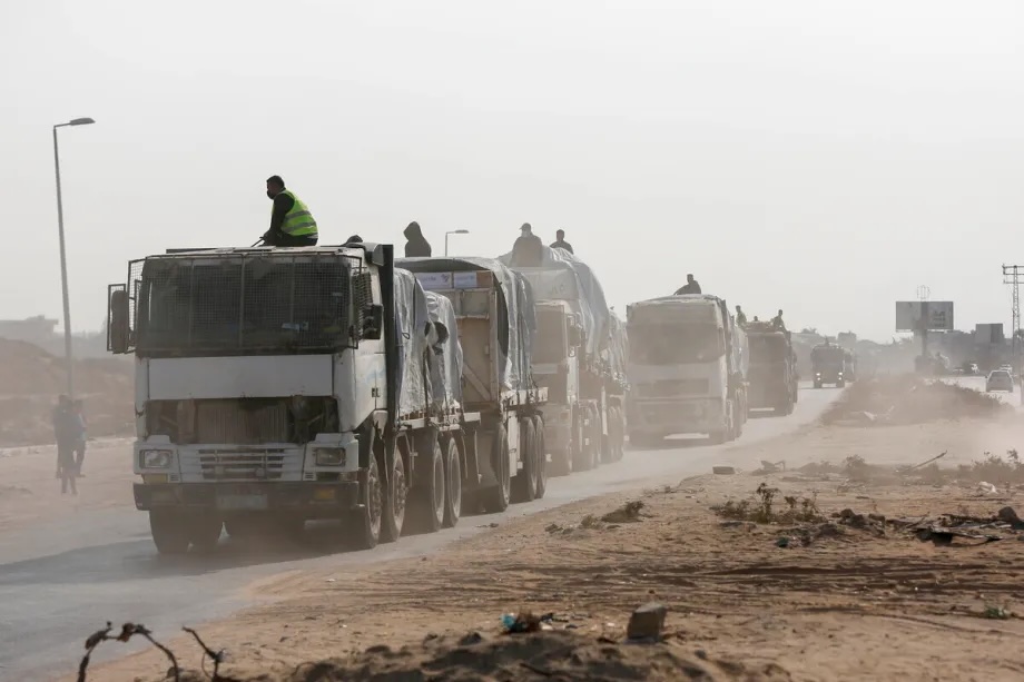 Trucks carrying humanitarian aid are heading towards in Deir al-Balah, Gaza on November 12, 2025.