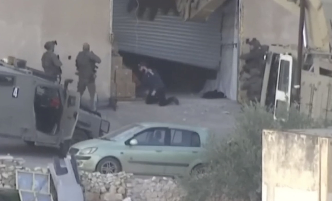 Screenshot from footage showing moments leading up to Israeli forces' apparent extrajudicial execution of 2 Palestinians after they surrender, in the occupied West Bank on Nov 27, 2025