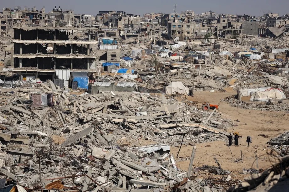 Palestinians return to the Al-Zerka area of the Al-Tuffah neighborhood after the ceasefire continue to live amid destroyed buildings and makeshift shelters on November 23, 2025.