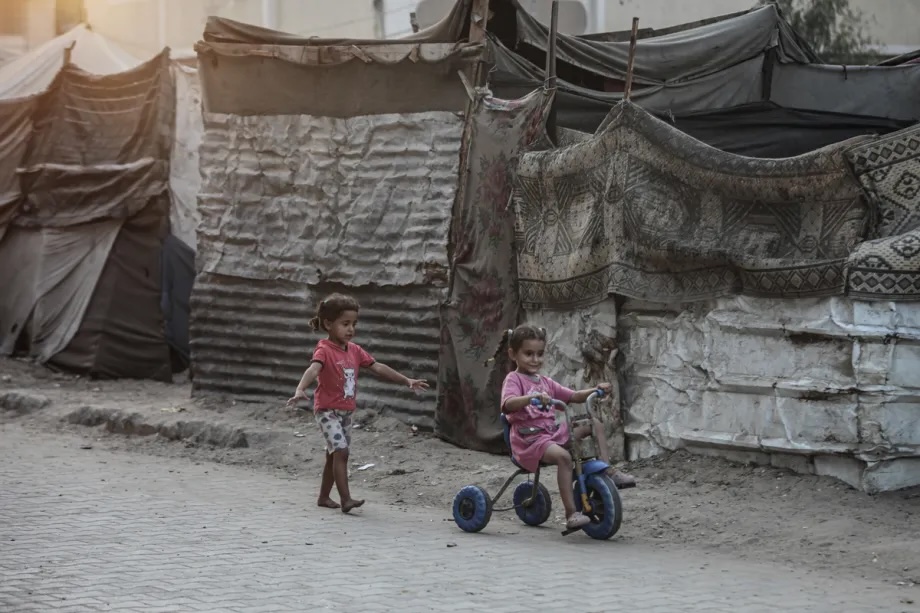 Children ride bike as daily struggle of Palestinians living in war-torn Nuseirat continues in Nuseirat, Gaza on November 01, 2025.
