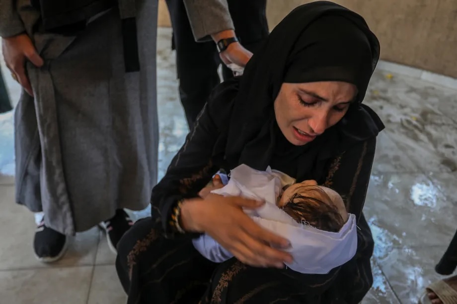 People mourn the baby Rahaf Abu Jazar, who lost her life due to cold weather conditions in Khan Younis, Gaza, on December 11, 2025.