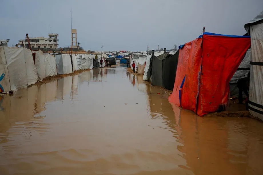 Palestinians struggle with flooding after heavy rain hits Deir al-Balah, Gaza, on December 11, 2025.