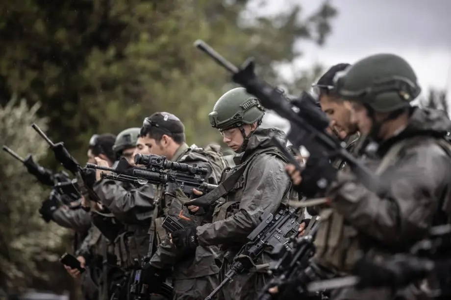 Israeli soldiers congregate on the Gaza border, in Nahal Oz, Israel on December 13, 2023
