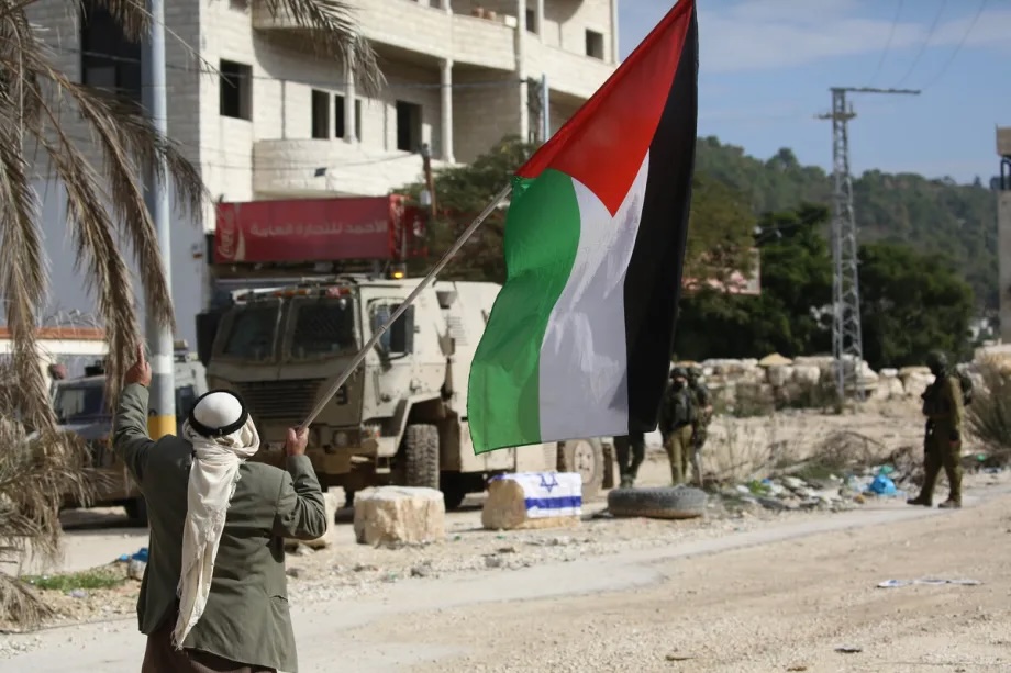Israeli soldiers close the main entrance to the Nur Shams refugee camp, preventing citizens from reaching the demolition site where the Israeli army plans to demolish 25 more buildings, in Tulkarm, West Bank on December 15, 2025.