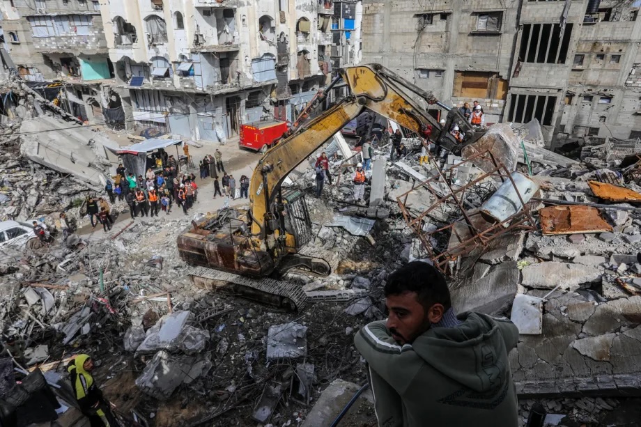 Civil defense teams continue searching with heavy machinery for the bodies of Palestinians killed in Israeli attacks and trapped under rubble in the al-Amal neighborhood of Khan Younis, Gaza, on December 20, 2025.