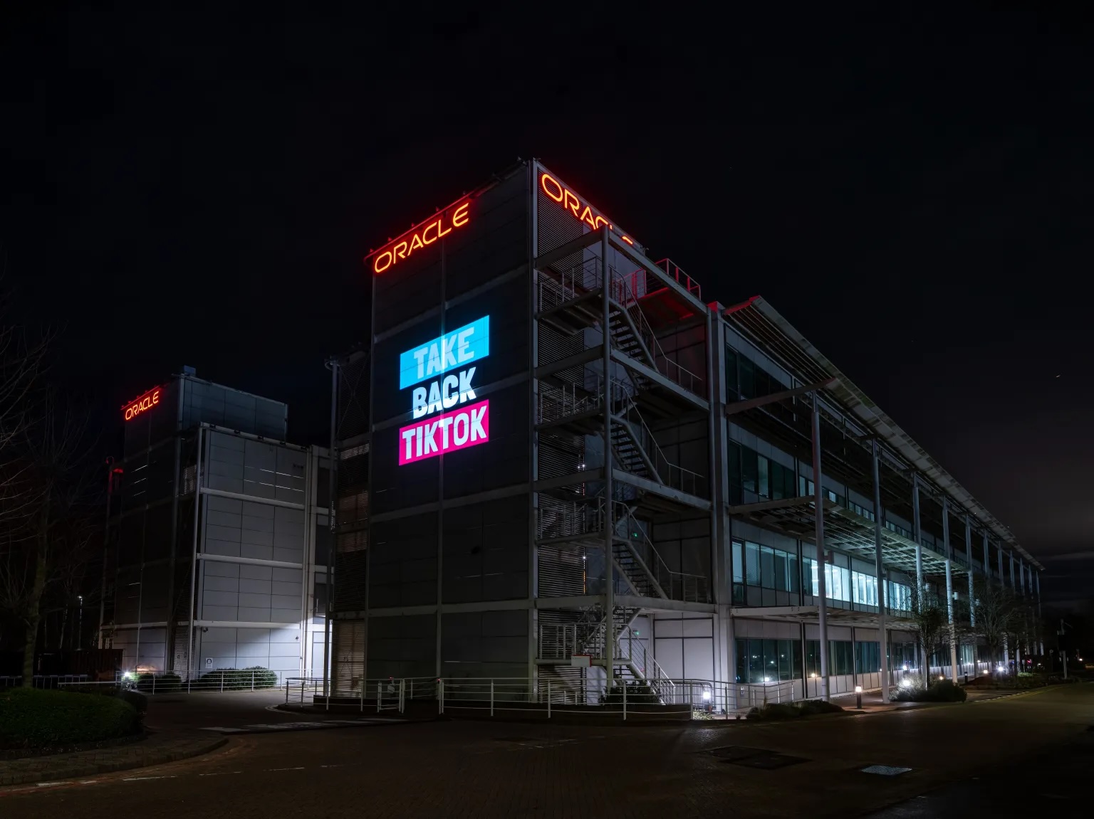 Organizers with the #TakeBackTikTok campaign projected a film about Larry Ellison’s pro-Israel agenda on Oracle’s U.K. headquarters on Dec. 12, 2025.