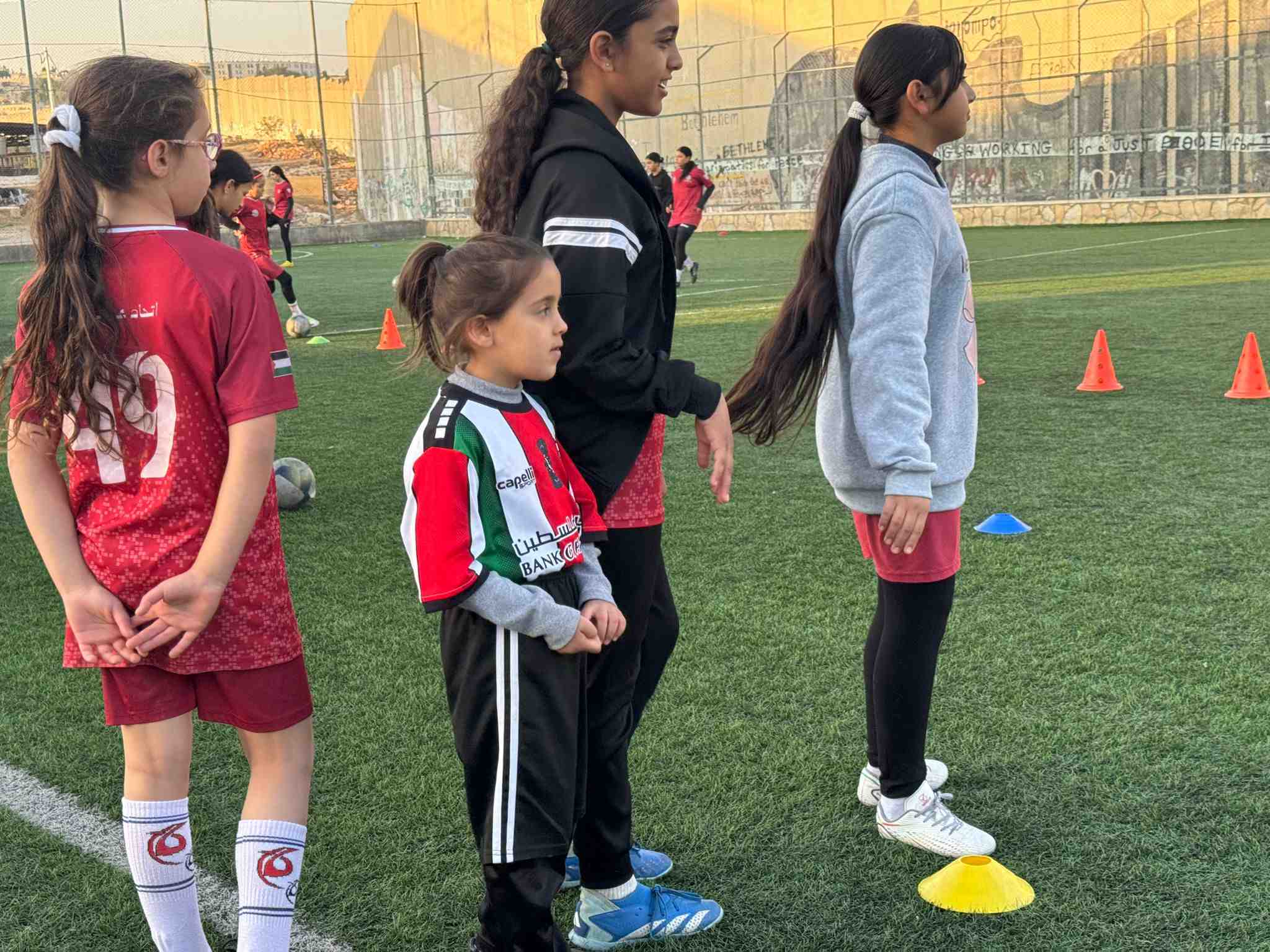 Children from Aida refugee camp take part in a coaching session