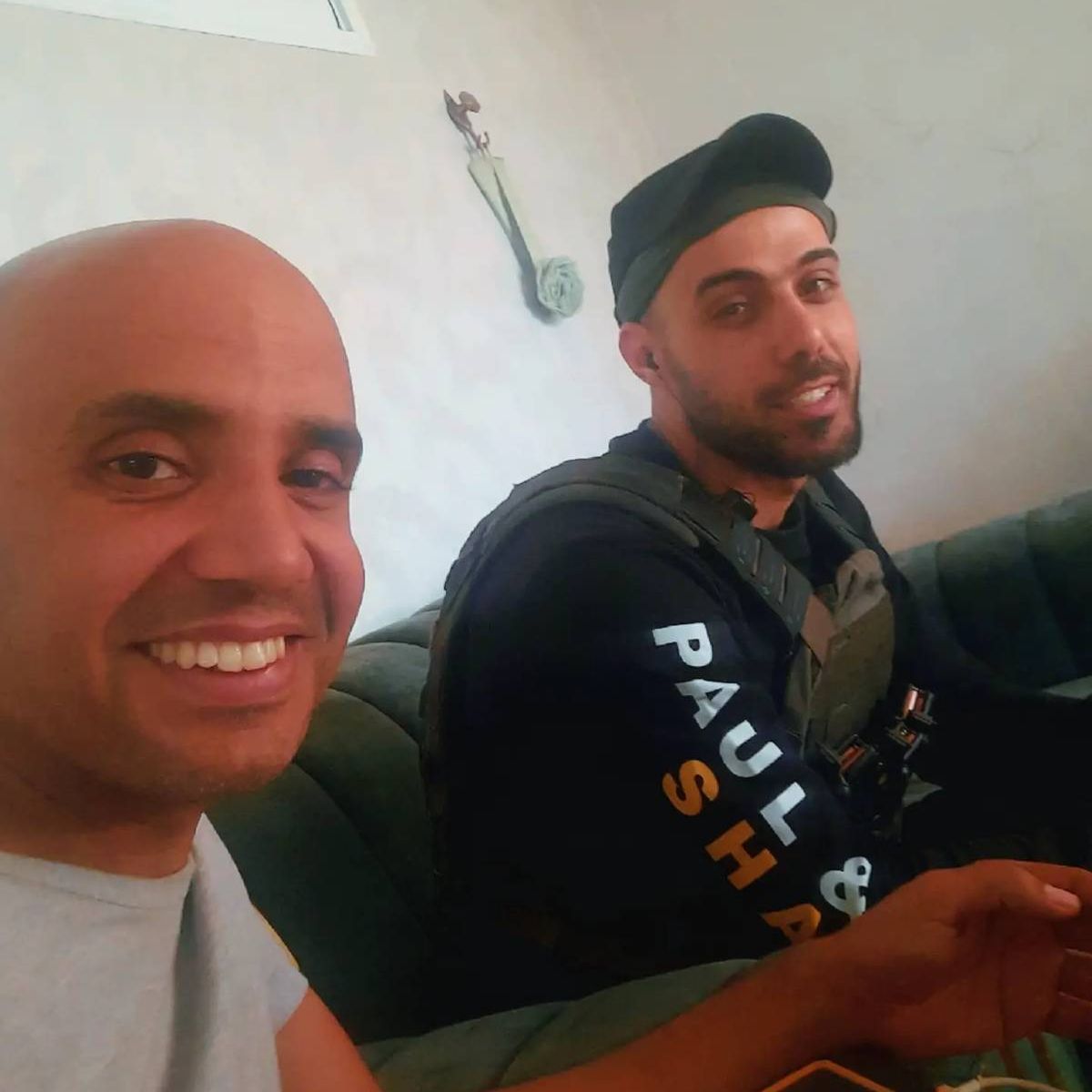 Issam Nabahin (R) with Ghassan Al Duhine, commander of the Popular Forces' military wing.