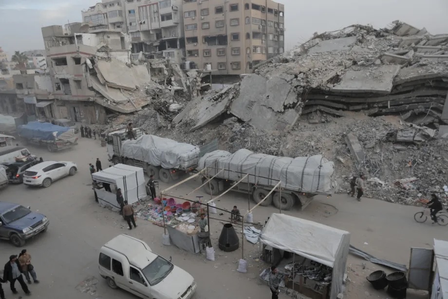 Humanitarian aid trucks reach the Gaza City via the Kissufim Border Crossing in central Gaza on December 8, 2025.