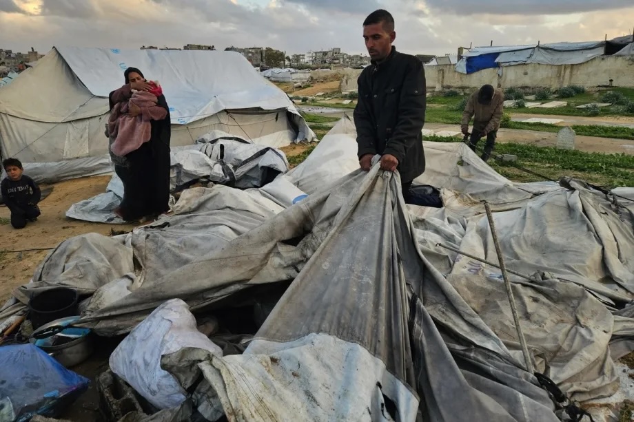 Displaced Palestinians struggle after heavy rainfall and strong winds rendered shelters unusable in Khan Younis, in the Gaza Strip, amid worsening humanitarian conditions on January 9, 2026.