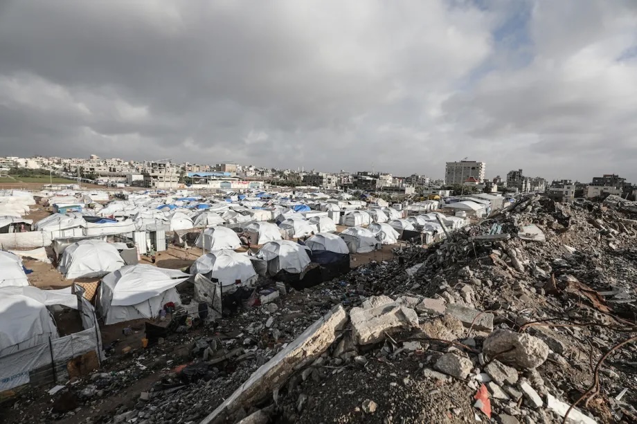 Palestinians struggle in the Bureij Refugee Camp in central Gaza on January 13, 2026. Storms and heavy rainfall affecting the Gaza Strip have severely impacted the lives of Palestinians living in makeshift tents.