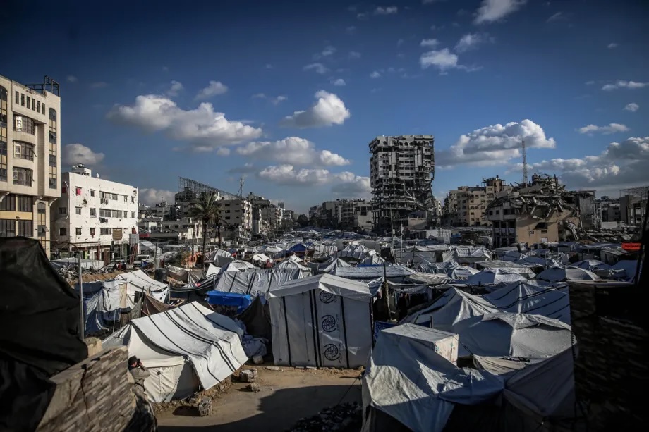 A view of the Bank of Palestine building, located in the Al-Rimal neighborhood of Gaza City and heavily damaged by Israeli attacks, poses a risk to thousands of Palestinians living in tents nearby, on January 15, 2026.