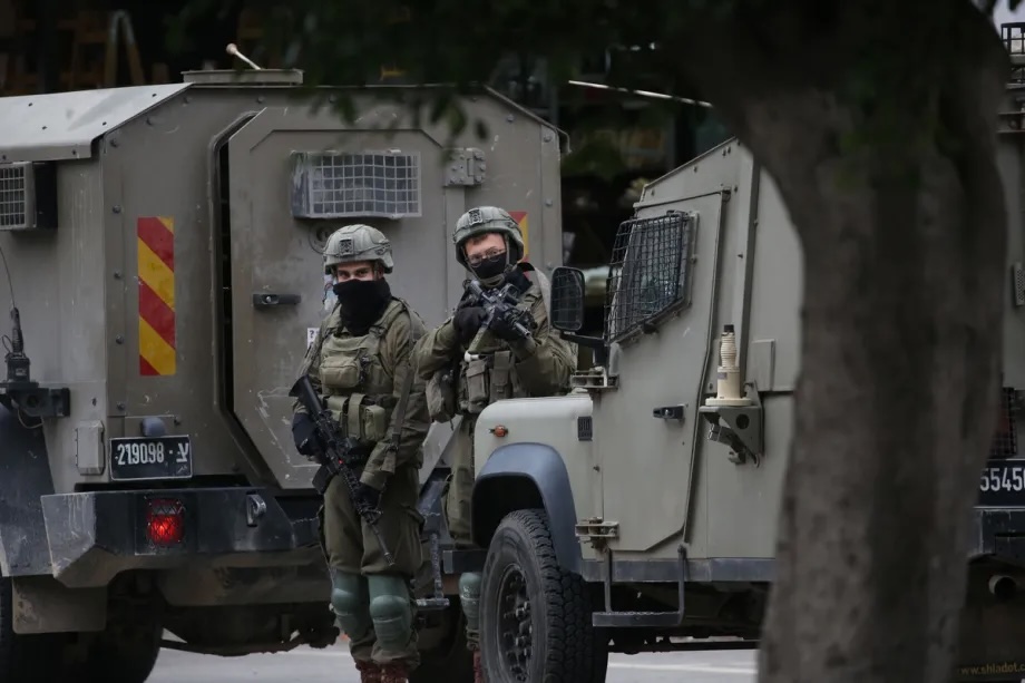 Israeli military forces launch a raid as reinforcement units patrol streets and establish checkpoints throughout the area in Nablus, West Bank on January 22, 2026.