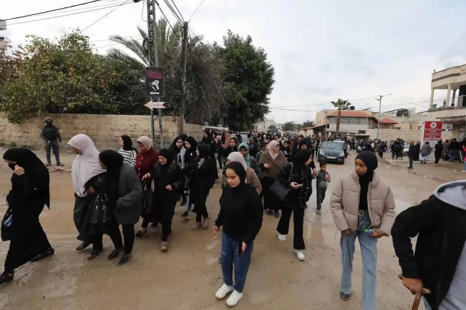 Palestinians gather at the main entrance of Jenin Refugee Camp as the Israeli army prevent thousands from returning to their homes in Jenin, West Bank on February 19, 2025.
