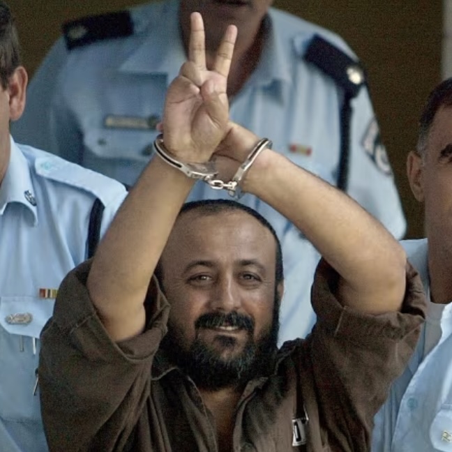 Palestinian leader Marwan Barghouti is taken away under escort on September 29, 2003 in Tel Aviv, Israel, after proceedings in his trial in the Tel Aviv District Court.