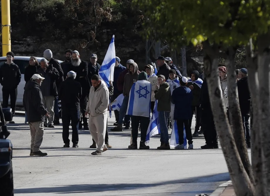 Dozens of Israeli settlers from the Kiryat Arba settlement, built on Palestinian land in the southern West Bank, raid the Kayzun area east of Hebron, with Israeli flags waved and racist slogans shouted at the local population on December 10, 2025.