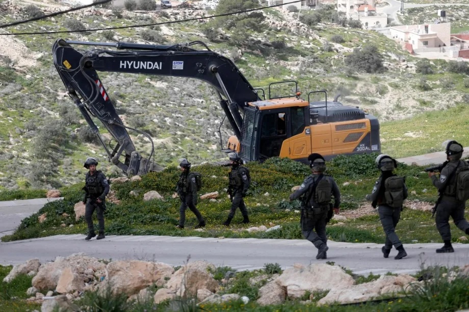 Israeli soldiers take security measures as the army demolishes a Palestinian home claiming it is “unlicensed” in the village of Beit Awwa near Hebron, West Bank on February 11, 2026.
