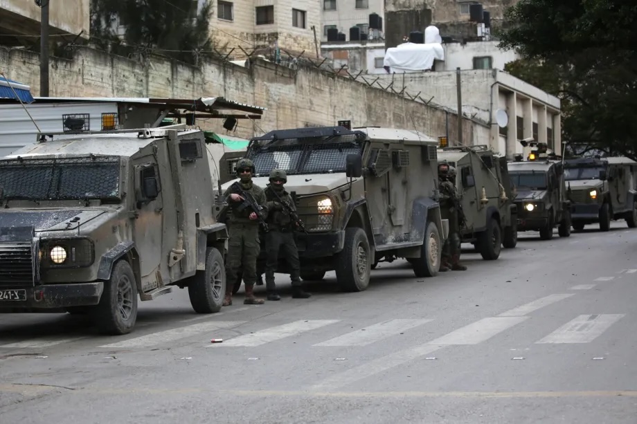 Israeli military forces launch a raid as reinforcement units patrol streets and establish checkpoints throughout the area in Nablus, West Bank on January 22, 2026.