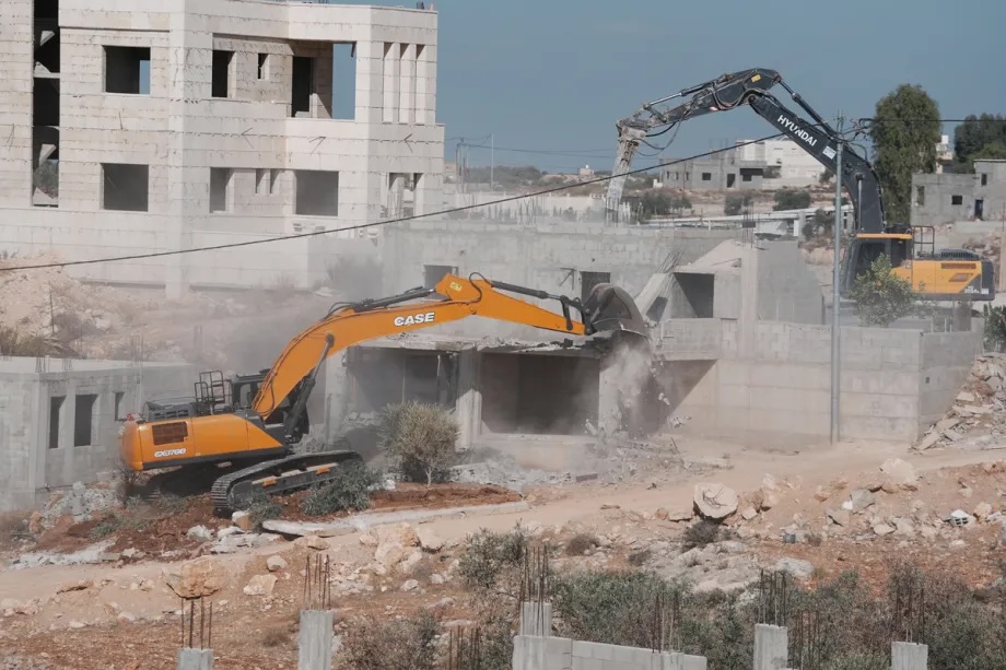 The Israeli army demolishes two Palestinian homes in the town of Shuqba, west of Ramallah in the central West Bank on October 28, 2025.