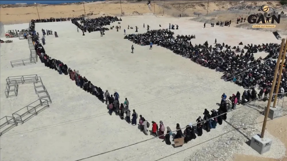 Screenshot of a video posted on Andrzej Gasiorowski's YouTube channel from a Gaza Humanitarian Foundation distribution site in 2025.