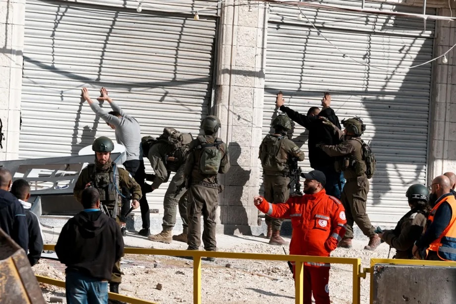 Israeli troops search Palestinians who attempted to enter the camp to retrieve their belongings as Israeli army continues its attacks on the Nur Shams Camp in the city of Tulkarem in the West Bank on December 17, 2025.