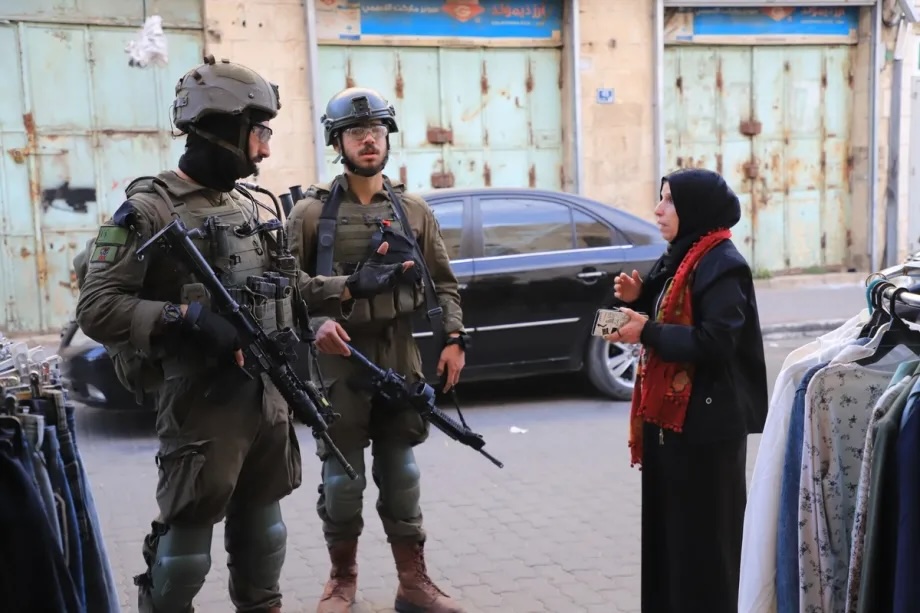 Israeli soldiers stop vehicles and carry out searches during a raid in the Old City of Hebron, in the southern West Bank, on February 16, 2026.